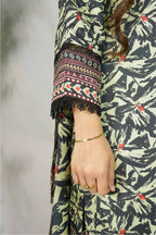 Person wearing a patterned outfit with a focus on the sleeve and hand.