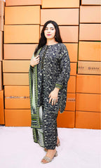 Woman in a patterned outfit standing in front of orange boxes with 'Gray' branding.