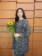 Woman holding sunflowers in front of stacked boxes with 'GRT' branding.