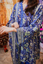 Person wearing a blue floral patterned outfit with a blurred background